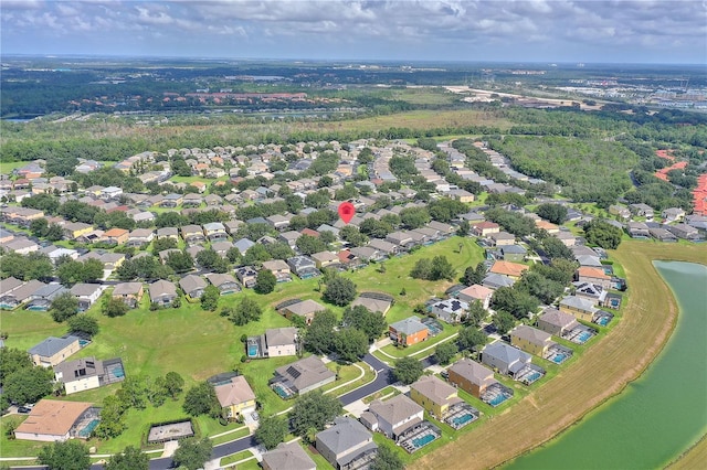 birds eye view of property featuring a water view and a residential view