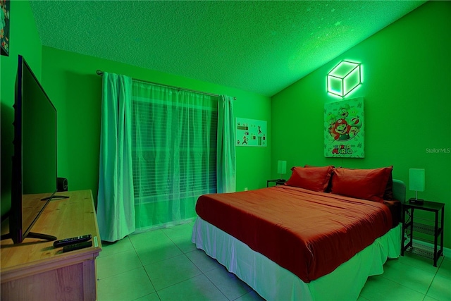 bedroom featuring vaulted ceiling, a textured ceiling, and light tile patterned floors