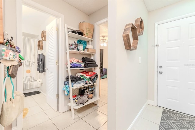 walk in closet featuring light tile patterned floors