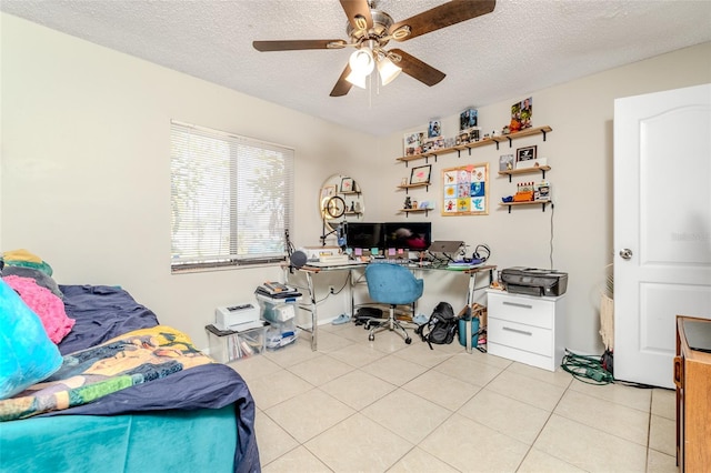 bedroom with a ceiling fan, a textured ceiling, and light tile patterned flooring