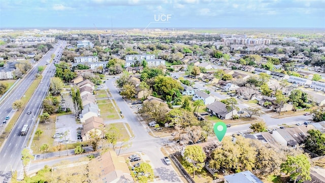 birds eye view of property with a residential view