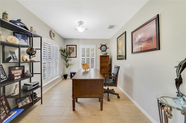 office area featuring baseboards and visible vents