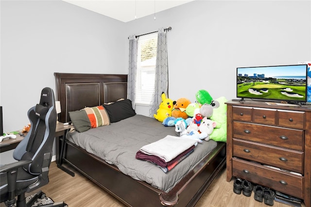 bedroom with light wood finished floors