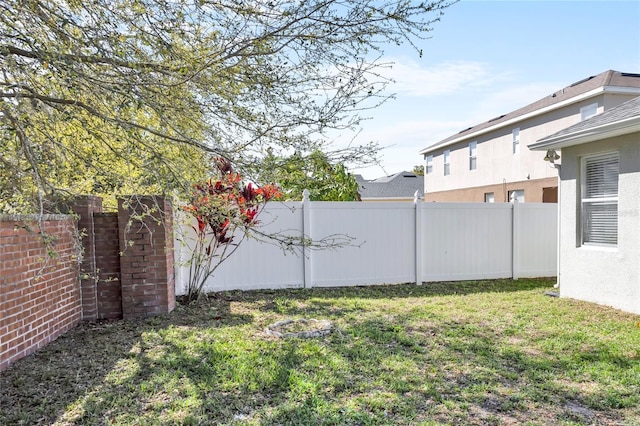 view of yard featuring a fenced backyard