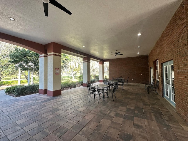 view of patio with ceiling fan and outdoor dining area