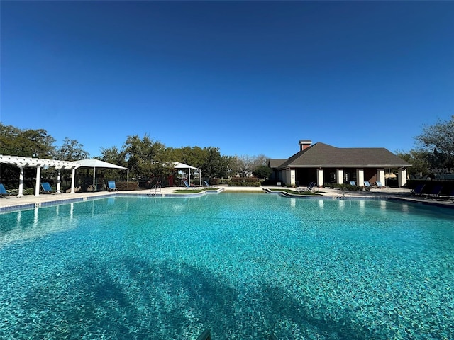 community pool featuring a patio and a pergola