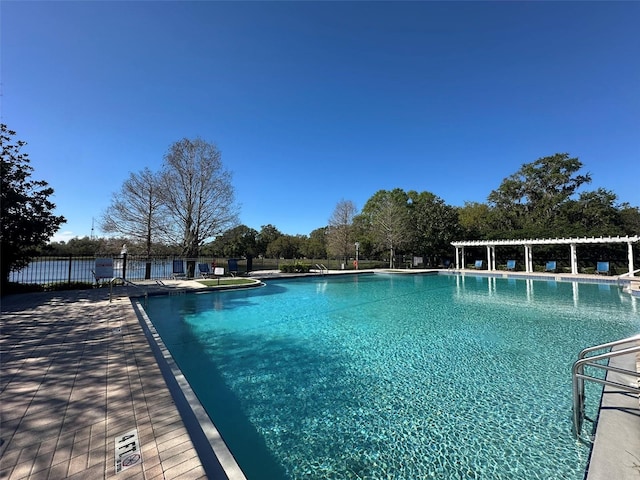 community pool featuring fence