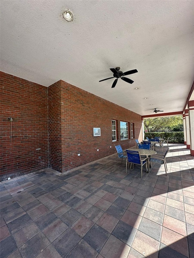 view of patio featuring ceiling fan