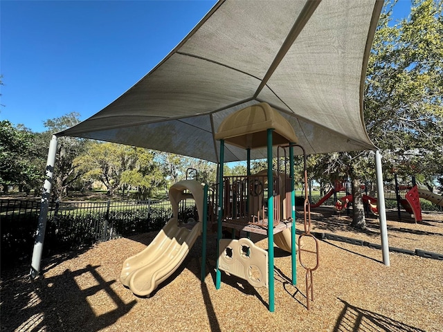 community play area featuring fence