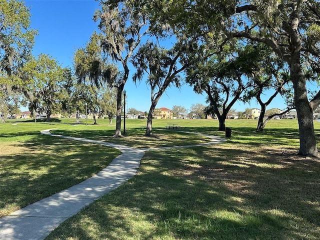 view of home's community featuring a lawn