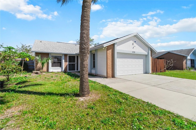 ranch-style home featuring an attached garage, a front yard, concrete driveway, and brick siding