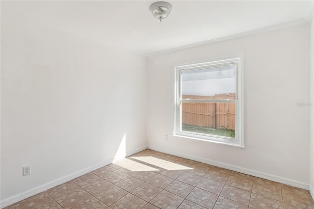 unfurnished room with baseboards