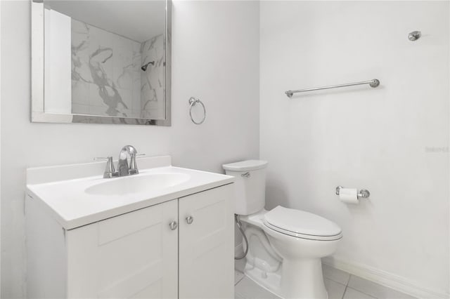 bathroom featuring baseboards, a shower, toilet, tile patterned flooring, and vanity