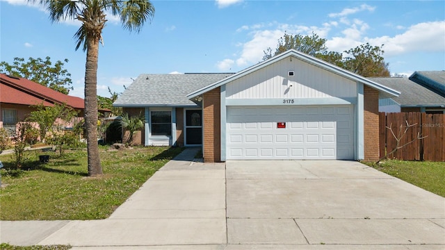 single story home featuring a garage, brick siding, fence, concrete driveway, and a front yard