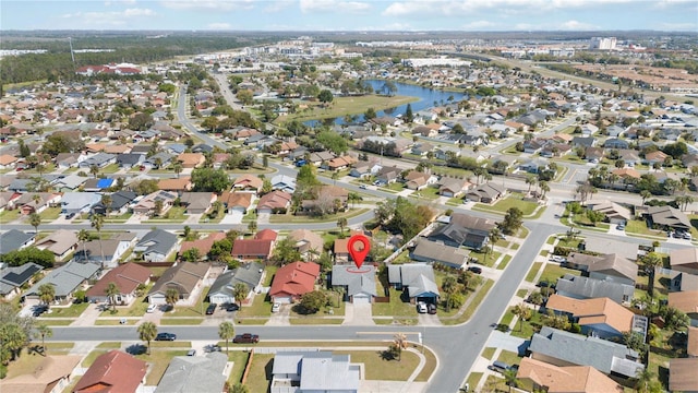 bird's eye view with a water view and a residential view