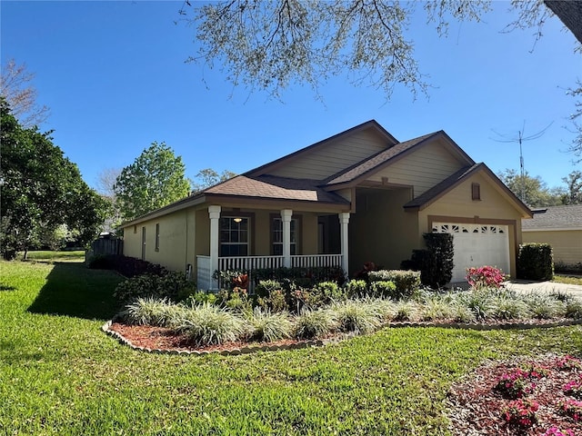 single story home with driveway, an attached garage, a front lawn, a porch, and stucco siding