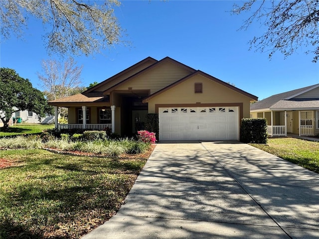 single story home featuring a garage, covered porch, driveway, stucco siding, and a front yard