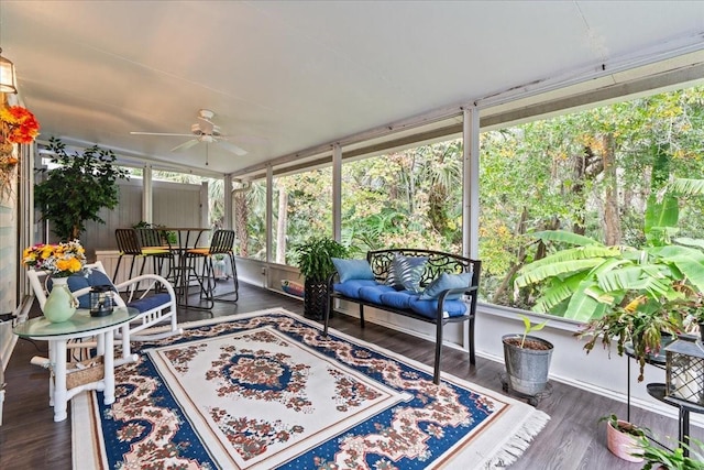 sunroom / solarium with a ceiling fan