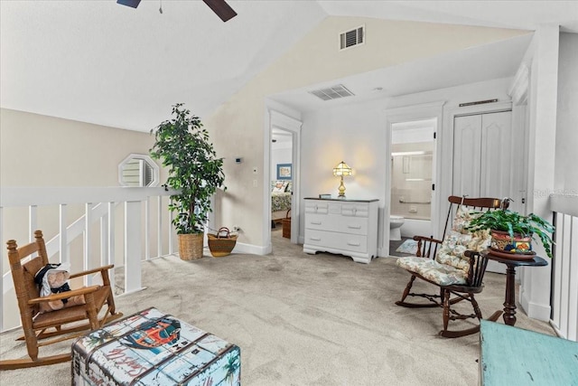 living area with lofted ceiling, carpet, visible vents, and a ceiling fan