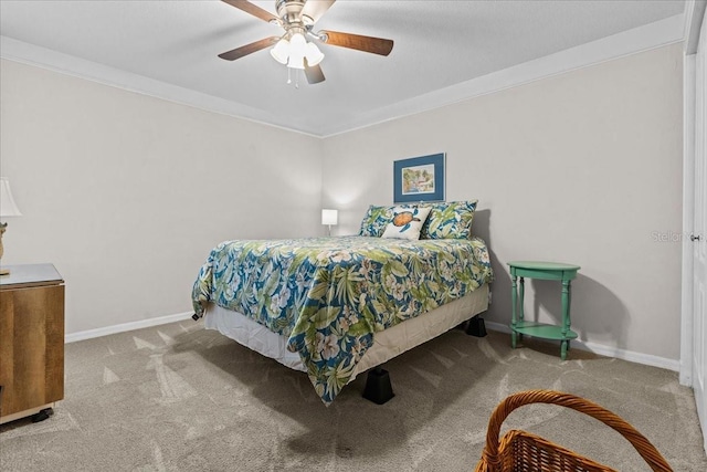 bedroom featuring carpet floors, ornamental molding, and baseboards