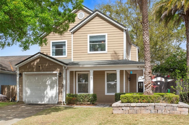 traditional home with a garage, fence, driveway, roof with shingles, and a front lawn