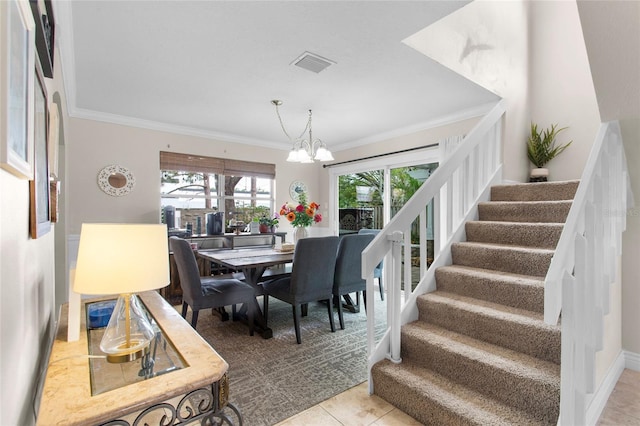 tiled dining area featuring a chandelier, stairway, visible vents, and crown molding