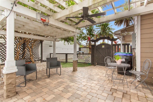 view of patio featuring fence, a gate, and a pergola