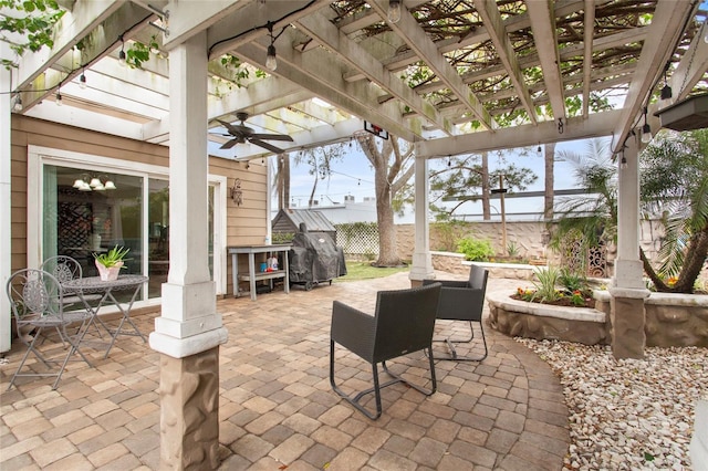 view of patio / terrace featuring fence, grilling area, and a pergola