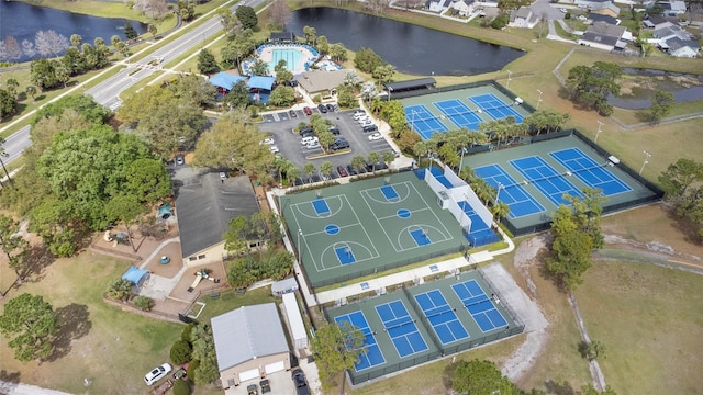 birds eye view of property with a water view