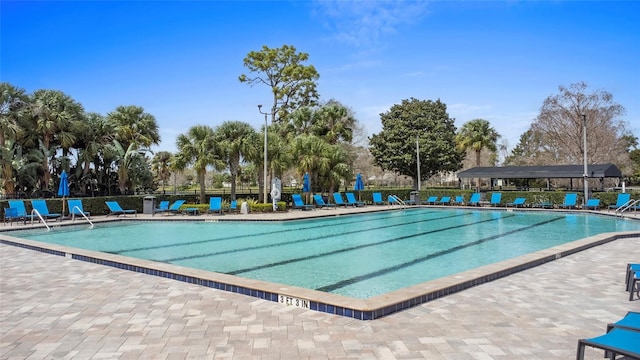 pool featuring a patio area and fence