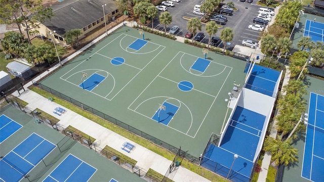 view of basketball court featuring community basketball court and fence