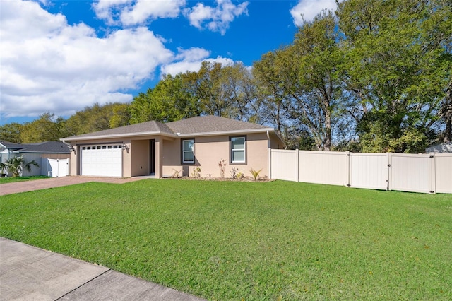 view of front facade with decorative driveway, fence private yard, a gate, and a front lawn