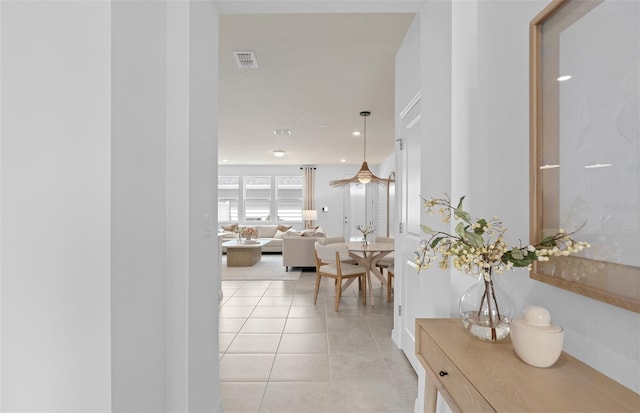 hall featuring recessed lighting, visible vents, and light tile patterned floors