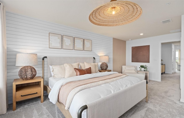 carpeted bedroom with baseboards and visible vents