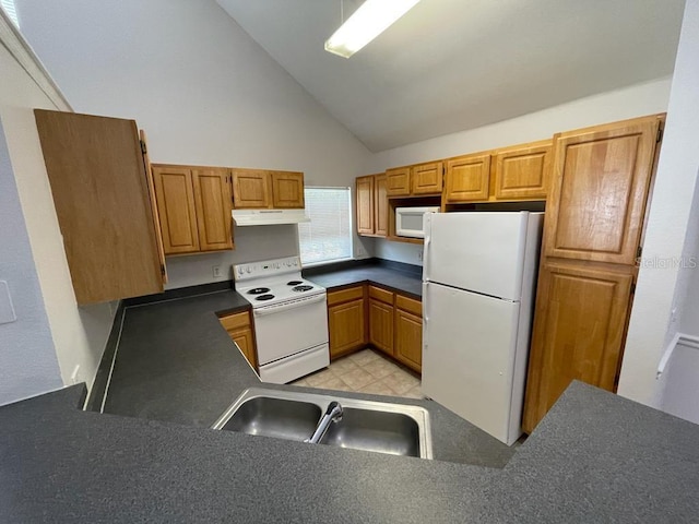 kitchen featuring white appliances, high vaulted ceiling, a sink, under cabinet range hood, and dark countertops