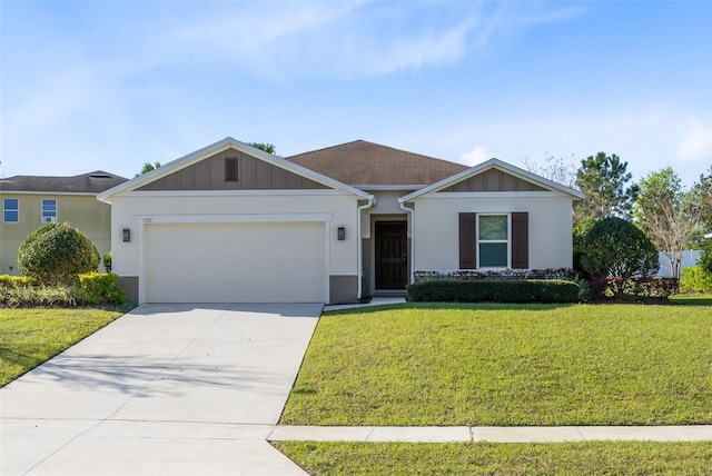 ranch-style house featuring a garage, driveway, a front lawn, and board and batten siding