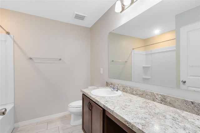 full bathroom featuring vanity, toilet, baseboards, walk in shower, and visible vents