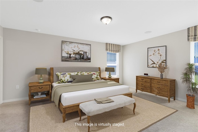 carpeted bedroom with baseboards