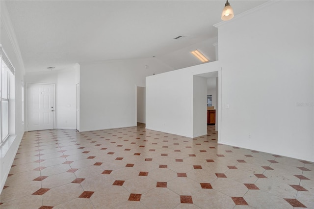 unfurnished room featuring lofted ceiling, ornamental molding, and light tile patterned flooring