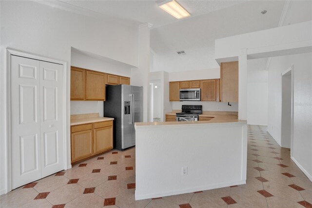 kitchen featuring high vaulted ceiling, stainless steel appliances, a peninsula, visible vents, and light countertops