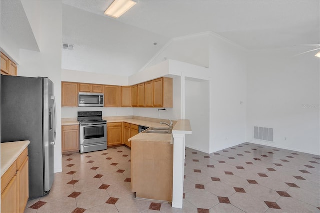 kitchen featuring visible vents, stainless steel appliances, a sink, and light countertops