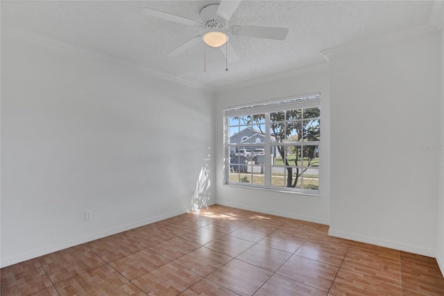 tiled spare room with a textured ceiling, baseboards, a ceiling fan, and crown molding