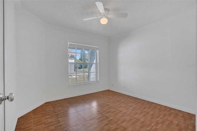 spare room with a textured ceiling, ornamental molding, a ceiling fan, and baseboards