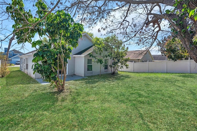 view of yard with a patio and fence