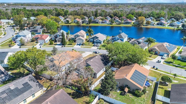 drone / aerial view featuring a water view and a residential view