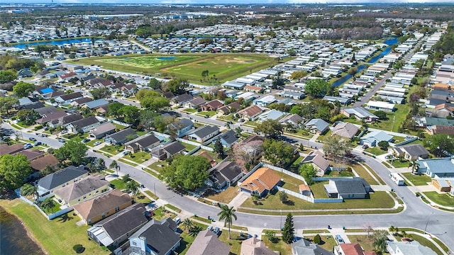 aerial view with a water view and a residential view