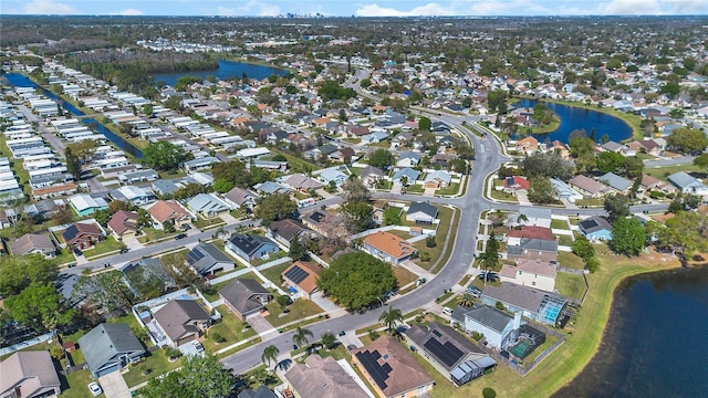 birds eye view of property featuring a residential view and a water view