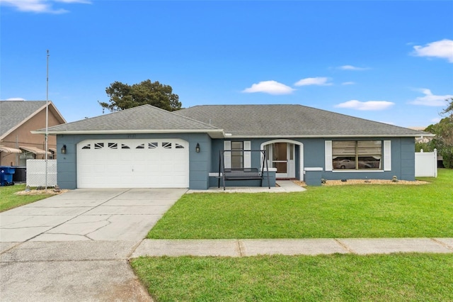 single story home featuring driveway, a shingled roof, an attached garage, fence, and a front lawn