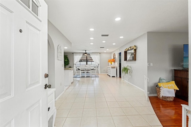 foyer with recessed lighting, light tile patterned flooring, visible vents, and baseboards