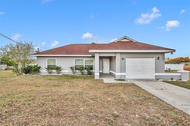 ranch-style home featuring stucco siding, driveway, a front lawn, fence, and a garage